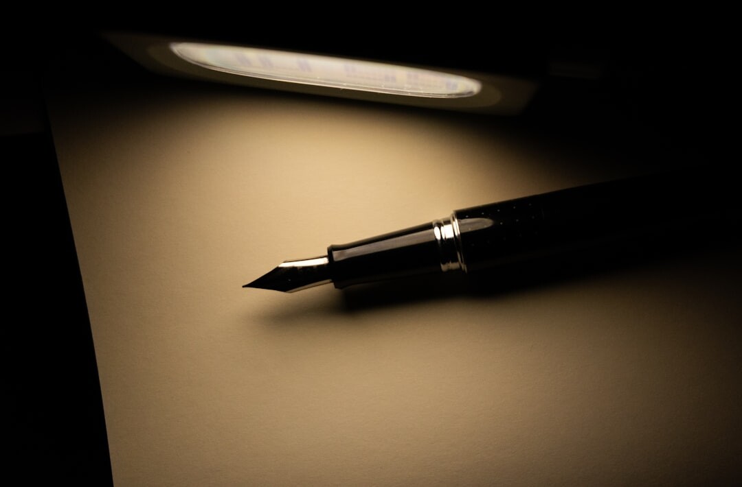Elegant writing desk with a fountain pen, letter and desk lamp